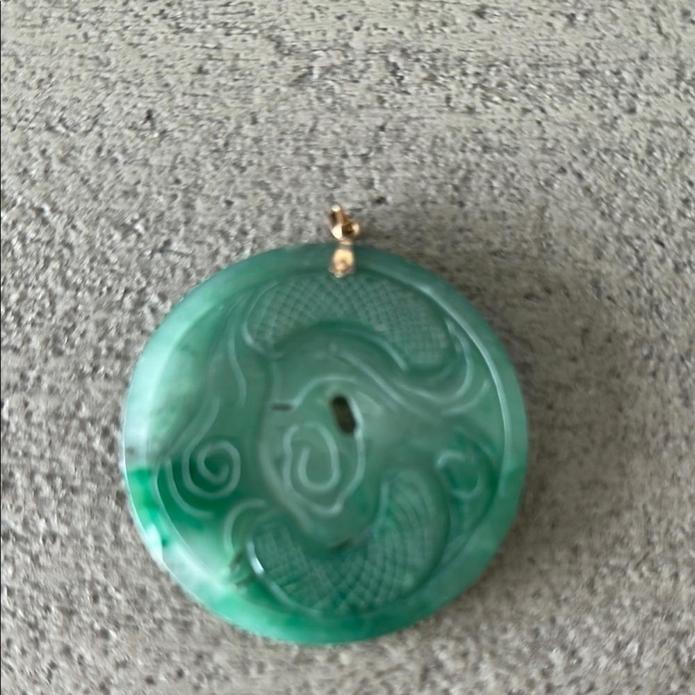 Green Jade Necklace with Intricate Carvings